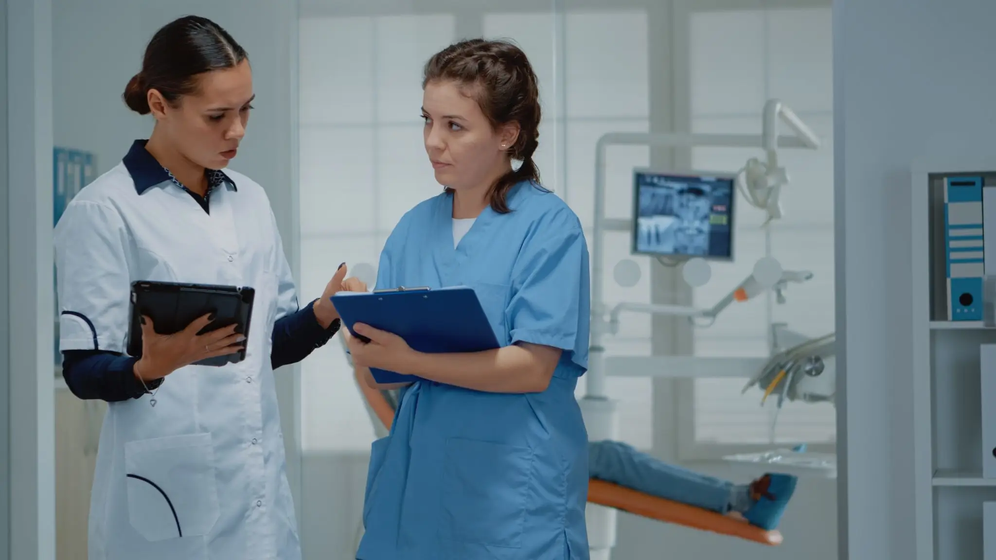 Doctor explaining clinical procedures to a nurse